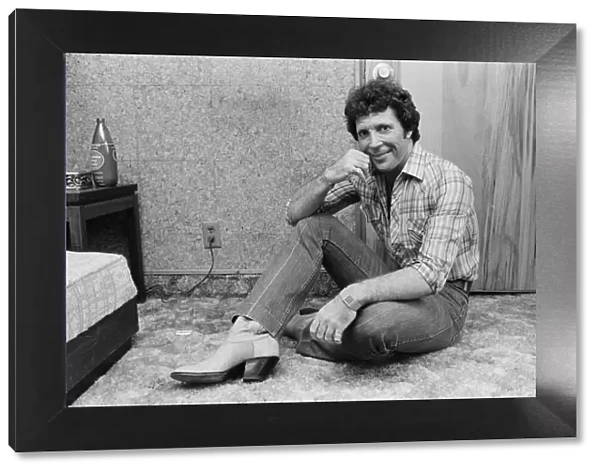 Tom Jones in concert in America. Pictured relaxing backstage. April 1983