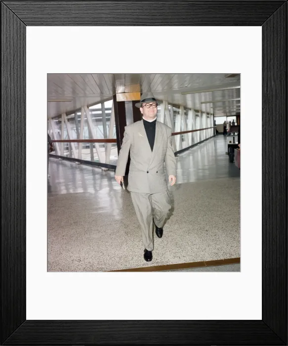 Framed Print : Elton John at London Airport. 29th July 1988
