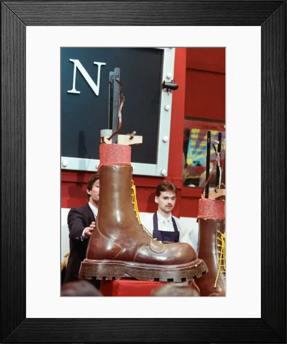 Framed Print : Sothebys auction of Elton John items. Eltons famous Doc Martin boots which he Framed Print : Sothebys auction of Elton John items. Eltons famous Doc Martin boots which he