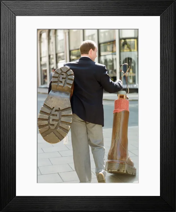 Framed Print : Sothebys auction of Elton John items. Eltons famous Doc Martin boots were Framed Print : Sothebys auction of Elton John items. Eltons famous Doc Martin boots were