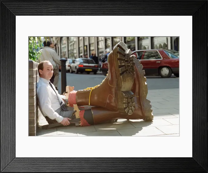 Framed Print : Sothebys auction of Elton John items. Eltons famous Doc Martin boots were Framed Print : Sothebys auction of Elton John items. Eltons famous Doc Martin boots were