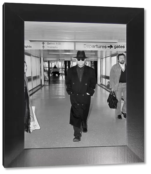 Elton John at Heathrow Airport, London. 26th August 1987
