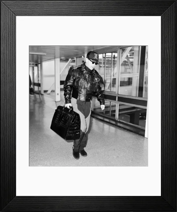 Framed Print : Elton John at Heathrow Airport, London. 25th September 1987 Framed Print : Elton John at Heathrow Airport, London. 25th September 1987