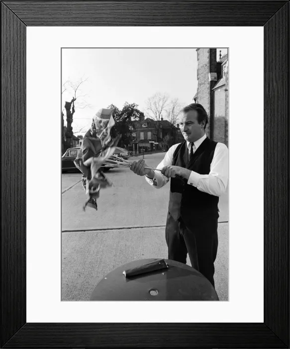 Framed Print : The Brolley Challenger - Jim Carver, of Orpington, taking an umbrella out of a case Framed Print : The Brolley Challenger - Jim Carver, of Orpington, taking an umbrella out of a case
