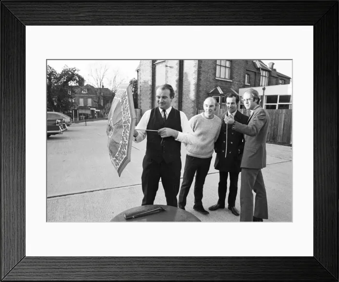 Framed Print : The Brolley Challenger - Jim Carver, of Orpington, taking an umbrella out of a case Framed Print : The Brolley Challenger - Jim Carver, of Orpington, taking an umbrella out of a case