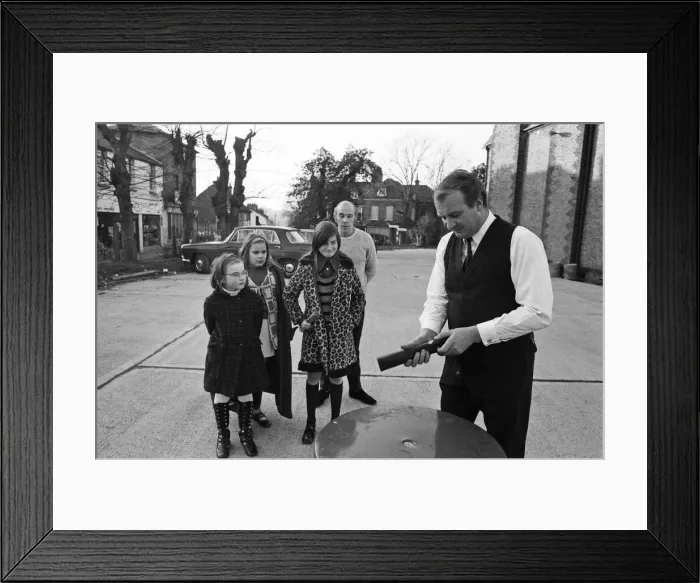 Framed Print : The Brolley Challenger - Jim Carver, of Orpington, taking an umbrella out of a case Framed Print : The Brolley Challenger - Jim Carver, of Orpington, taking an umbrella out of a case