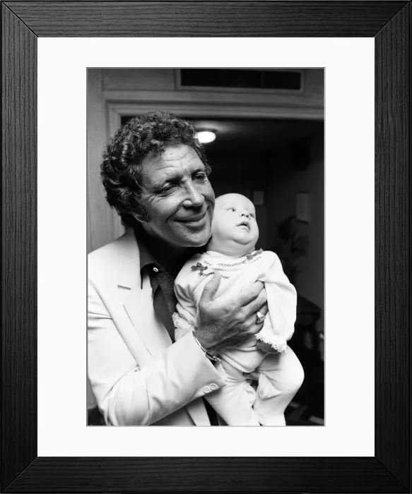 Framed Print : Tom Jones with his grandson Alexander, aged eleven months, in their London hotel Framed Print : Tom Jones with his grandson Alexander, aged eleven months, in their London hotel