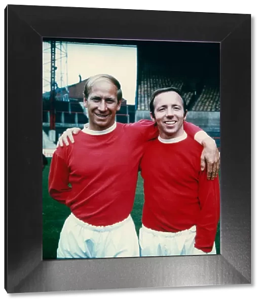 Bobby Charlton (left) with his Manchester United team mate, Nobby Stiles at Old Trafford