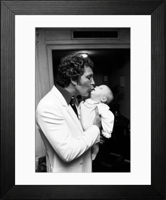Framed Print : Tom Jones with his grandson Alexander, aged eleven months, in their London hotel Framed Print : Tom Jones with his grandson Alexander, aged eleven months, in their London hotel