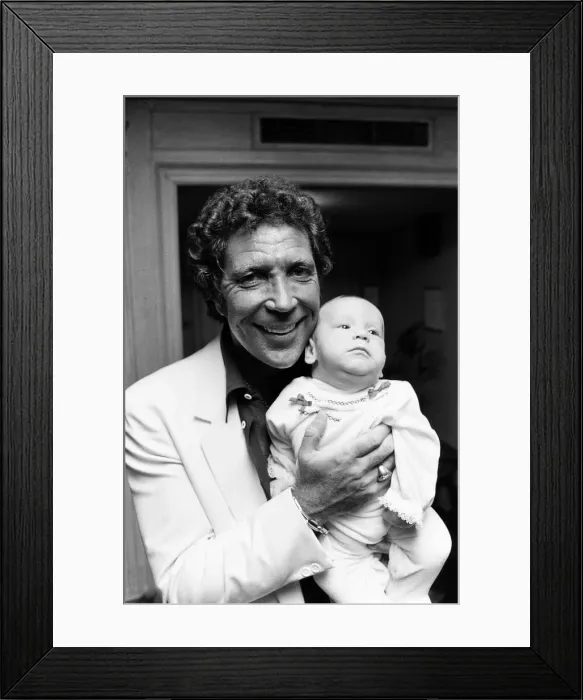 Framed Print : Tom Jones with his grandson Alexander, aged eleven months, in their London hotel Framed Print : Tom Jones with his grandson Alexander, aged eleven months, in their London hotel
