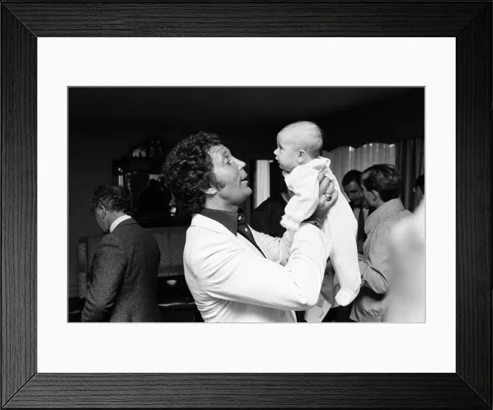 Framed Print : Tom Jones with his grandson Alexander, aged eleven months, in their London hotel Framed Print : Tom Jones with his grandson Alexander, aged eleven months, in their London hotel