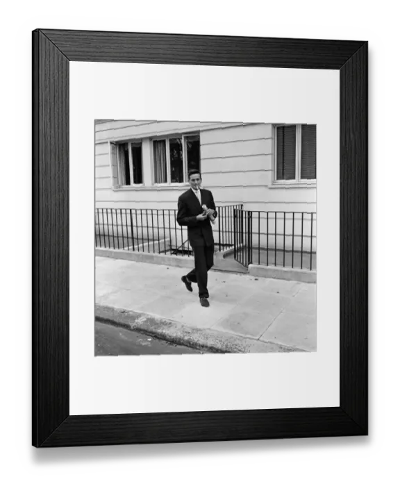 Framed Print : John Kennedy, manager to Tommy Steele, pictured leaving Sabrinas flat