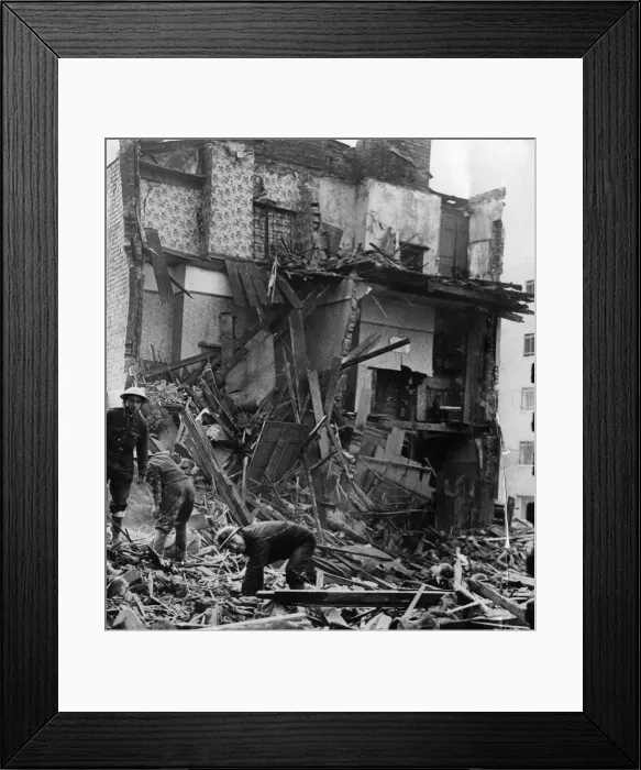 Framed Print : Air Raid Precautions workers salvaging in the debris of two working class houses bombed Framed Print : Air Raid Precautions workers salvaging in the debris of two working class houses bombed