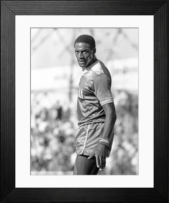 Framed Print : John Fashanu, stared at the photographer, during the Wimbledon at home against Liverpool Framed Print : John Fashanu, stared at the photographer, during the Wimbledon at home against Liverpool