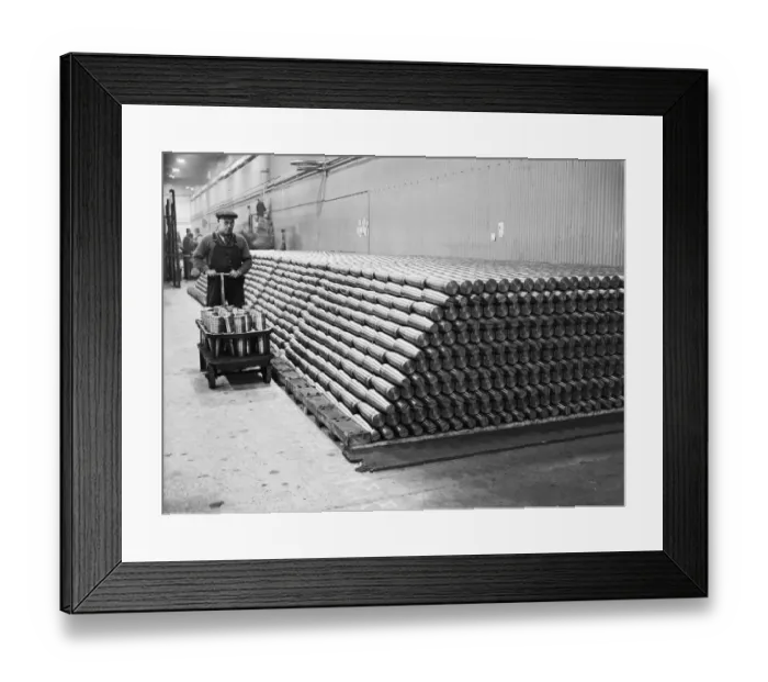 Framed Print : Stacking shells for anti-aircraft guns in a midland shell factory. 4th October 1939 Framed Print : Stacking shells for anti-aircraft guns in a midland shell factory. 4th October 1939