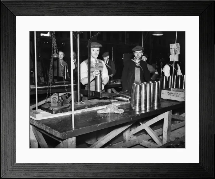 Framed Print : Stacking shells for anti-aircraft guns in a midland shell factory. 4th October 1939