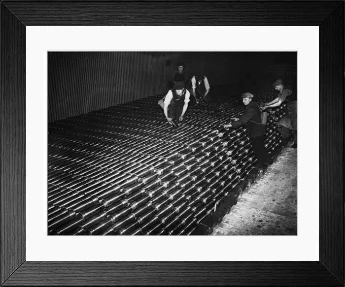 Framed Print : Stacking shells for anti-aircraft guns in a midland shell factory. 4th October 1939 Framed Print : Stacking shells for anti-aircraft guns in a midland shell factory. 4th October 1939