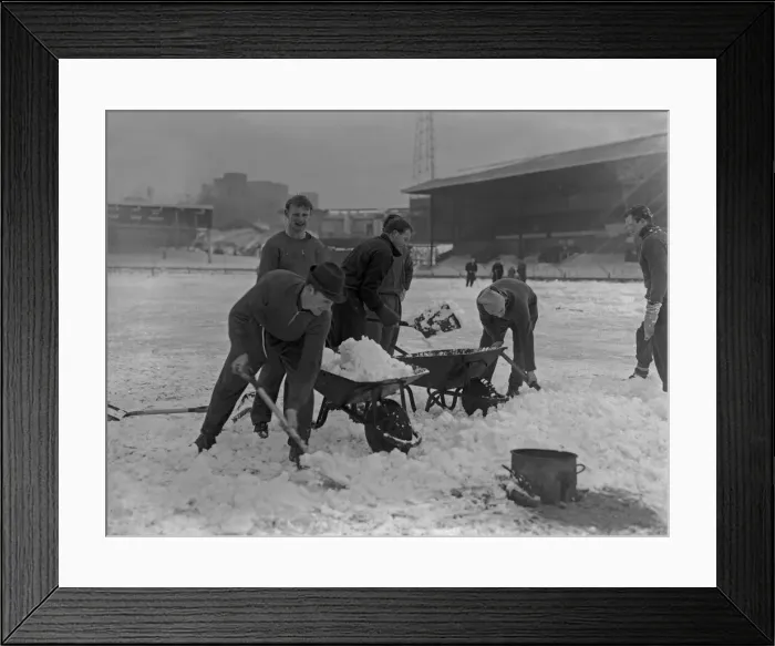 Framed Print : Grounds staff at Bristol Rovers Eastville Stadium struggle to clear snow from the pitch