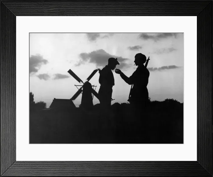 Framed Print : World War Two. Eventide in Holland'. British Soldiers pause to light their Framed Print : World War Two. Eventide in Holland'. British Soldiers pause to light their