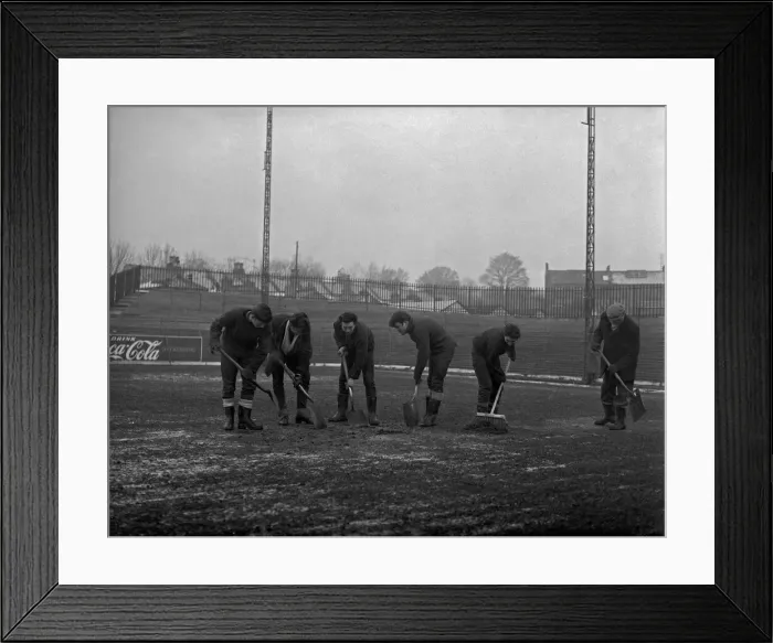 Framed Print : Grounds staff at Bristol Rovers Eastville Stadium struggle to clear snow from the pitch Framed Print : Grounds staff at Bristol Rovers Eastville Stadium struggle to clear snow from the pitch