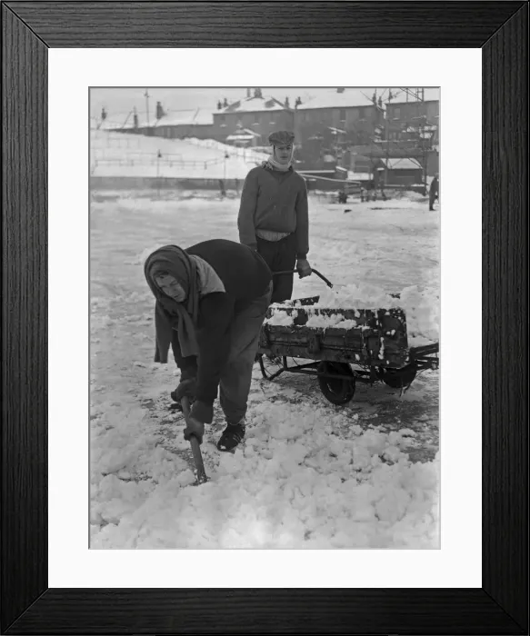 Framed Print : Grounds staff at Bristol Rovers Eastville Stadium struggle to clear snow from the pitch Framed Print : Grounds staff at Bristol Rovers Eastville Stadium struggle to clear snow from the pitch