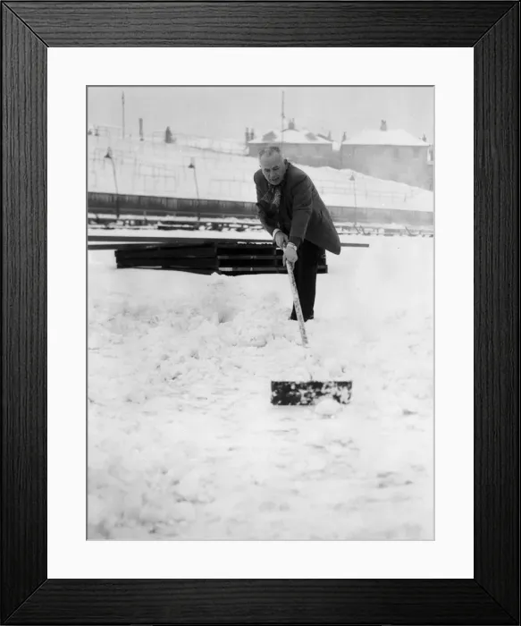 Framed Print : Grounds staff at Bristol Rovers Eastville Stadium struggle to clear snow from the pitch Framed Print : Grounds staff at Bristol Rovers Eastville Stadium struggle to clear snow from the pitch
