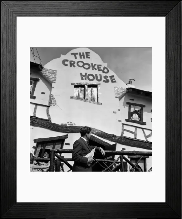 Framed Print : People enjoying their holidays in Southend, Essex. The Crooked House attraction Framed Print : People enjoying their holidays in Southend, Essex. The Crooked House attraction