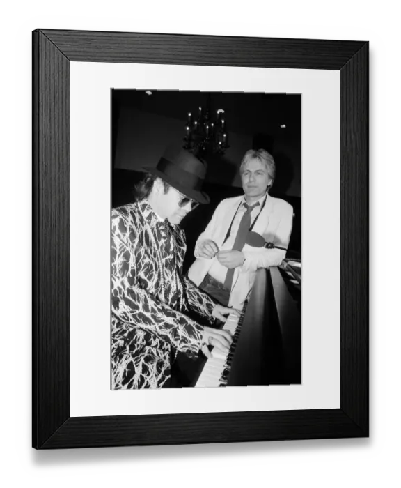 Framed Print : Elton John and Adam Faith at The Savoy, London. 1985