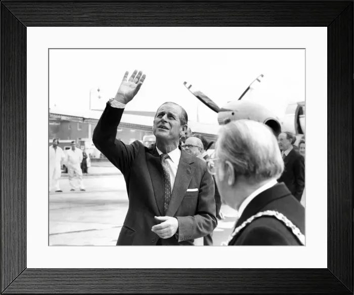 Framed Print : Prince Philip, Duke of Edinburgh waves to a party of happy school children who were Framed Print : Prince Philip, Duke of Edinburgh waves to a party of happy school children who were