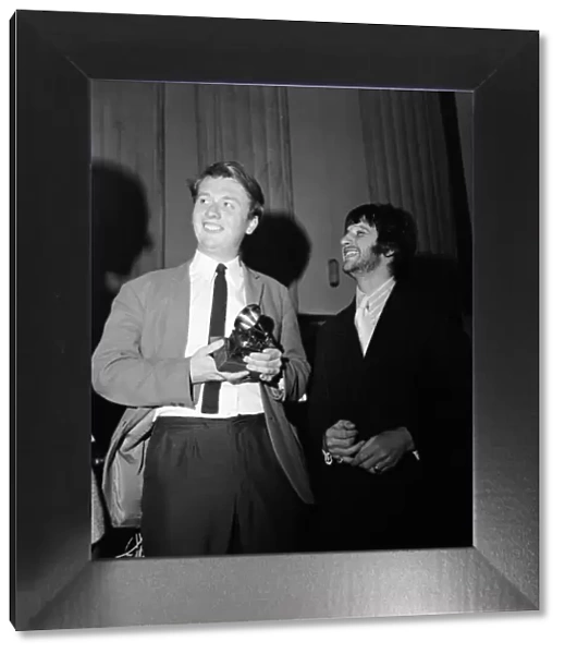 Beatles drummer Ringo Starr presents a Grammy Award to 22-year-old EMI recording engineer