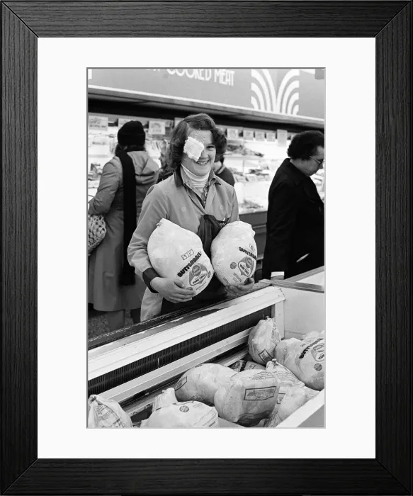 Framed Print : Turkeys fall on girl in a supermarket, Teesside. 1977