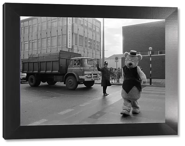 A man dressed up as a 7ft bear, Middlesbrough. Pictured crossing the road outside