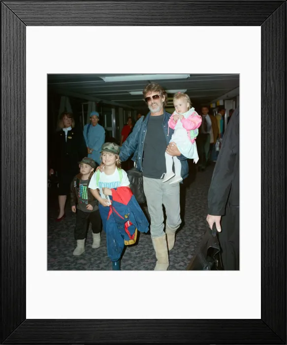 Framed Print : Members of The Highwaymen at Heathrow Airport. Kris Kristofferson and children Framed Print : Members of The Highwaymen at Heathrow Airport. Kris Kristofferson and children