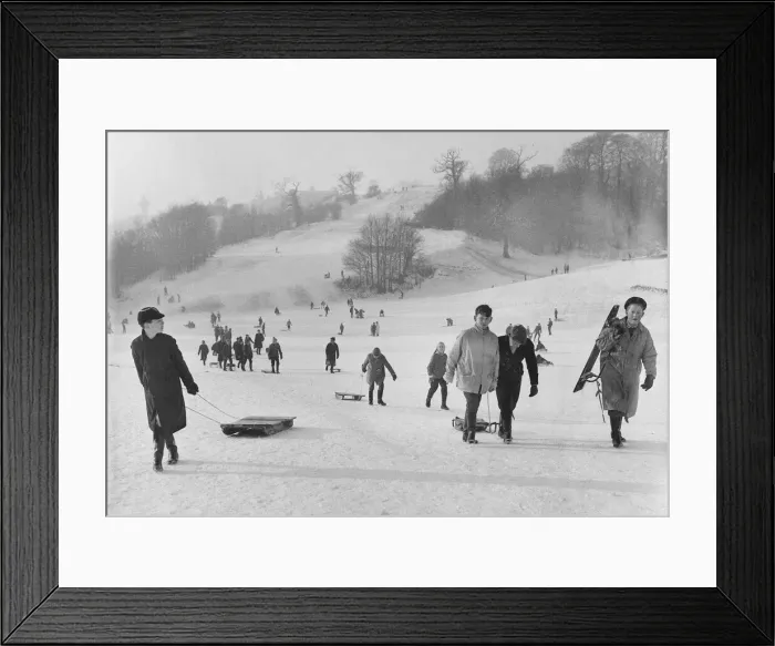 Framed Print : Children take the slopes of a Bristol park after a fresh fall of snow. 2nd January 1962 Framed Print : Children take the slopes of a Bristol park after a fresh fall of snow. 2nd January 1962