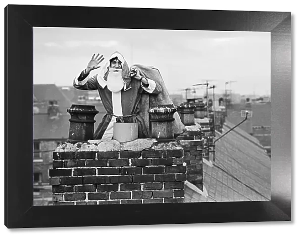 Father Christmas on rooftops, in Middlesbrough. Circa 195