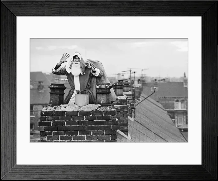 Framed Print : Father Christmas on rooftops, in Middlesbrough. Circa 195 Framed Print : Father Christmas on rooftops, in Middlesbrough. Circa 195