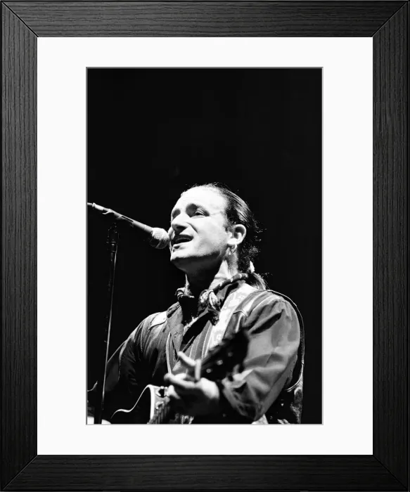Framed Print : Rock group U2 in concert in USA. Bono singing and playing guitar. May 1987 Framed Print : Rock group U2 in concert in USA. Bono singing and playing guitar. May 1987