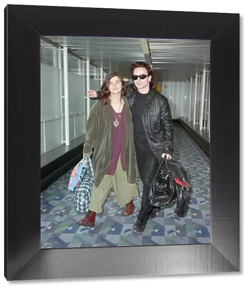 Bono of rock group U2 and his wife Ali pictured at London Airport. 10th October 1991