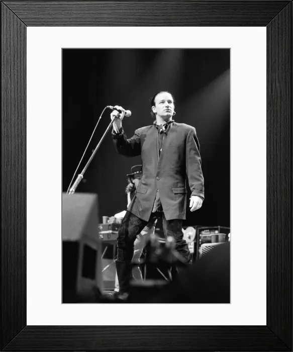 Framed Print : Rock group U2 in concert in USA. Bono singing on stage. May 1987 Framed Print : Rock group U2 in concert in USA. Bono singing on stage. May 1987