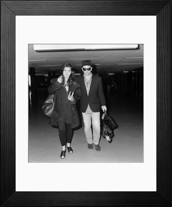 Framed Print : Bono of rock group U2 and his wife Ali pictured at London Airport. 16th July 1987