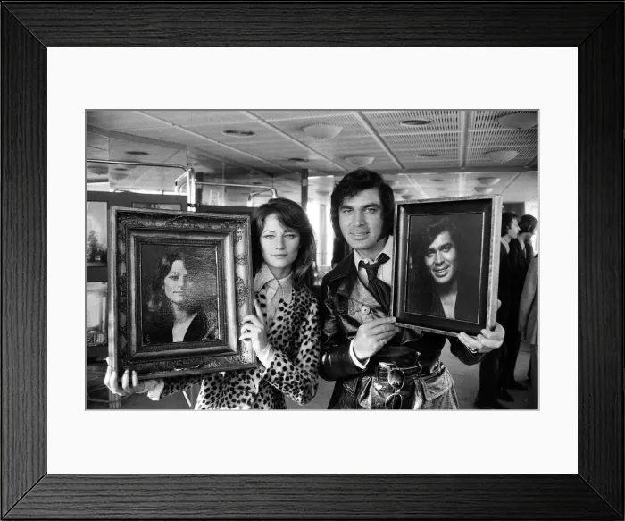 Framed Print : Charlotte Rampling and Engelbert Humperdinck with their portraits at a celebrity portrait Framed Print : Charlotte Rampling and Engelbert Humperdinck with their portraits at a celebrity portrait