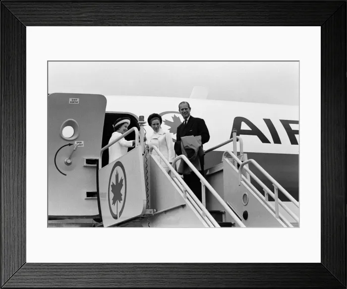 Framed Print : The Queen, followed by Princess Anne and The Duke of Edinburgh boarding the plane for a Framed Print : The Queen, followed by Princess Anne and The Duke of Edinburgh boarding the plane for a