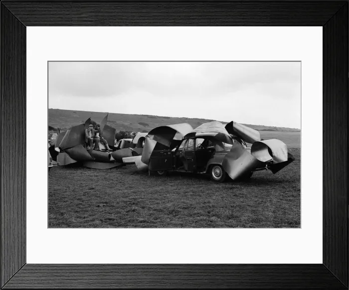 Framed Print : Isle of Wight Festival. Two Swedish hippy types sitting on top of cars that look like Framed Print : Isle of Wight Festival. Two Swedish hippy types sitting on top of cars that look like