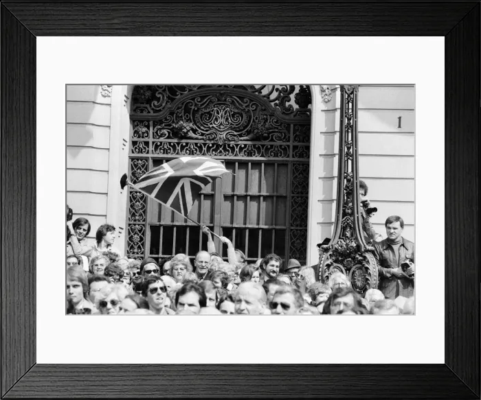 Framed Print : The royal tour of Switzerland. Pictured, a lone union jack on a broomstick being waved by Framed Print : The royal tour of Switzerland. Pictured, a lone union jack on a broomstick being waved by