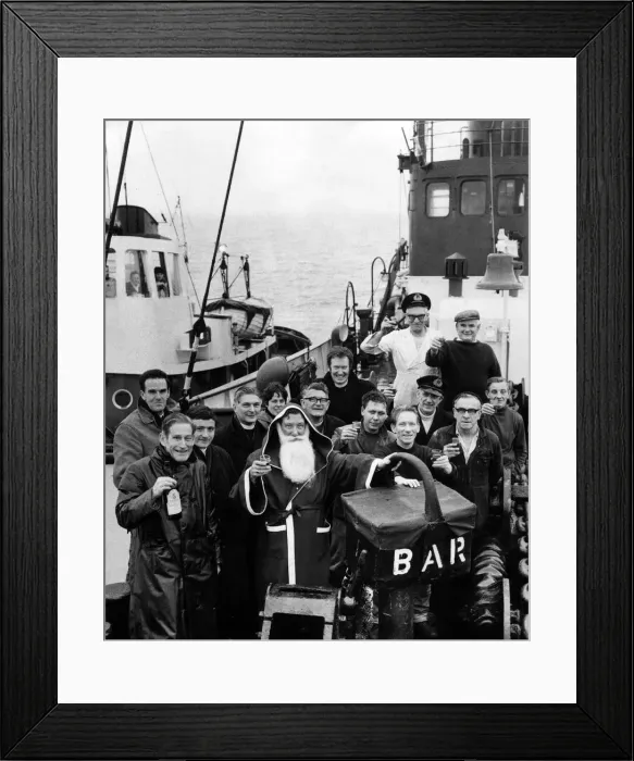 Framed Print : Trafalgar'Tug captain John French in the shape of Father Christmas safely