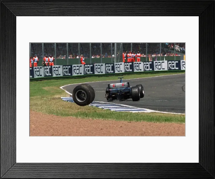 Framed Print : Mika Hakkinen British Grand Prix Silverstone July 1999 loses a wheel off his car Framed Print : Mika Hakkinen British Grand Prix Silverstone July 1999 loses a wheel off his car