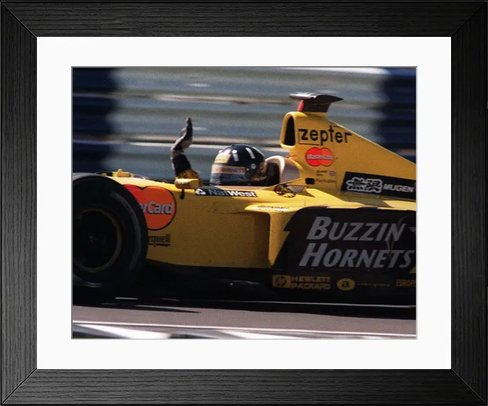 Framed Print : Damon Hill at the British Grand Prix July 1999 waves to the crowd at the end of Framed Print : Damon Hill at the British Grand Prix July 1999 waves to the crowd at the end of