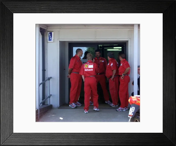 Framed Print : Ferrari team members rush to the medical centre for news on Michael Schumacher Framed Print : Ferrari team members rush to the medical centre for news on Michael Schumacher