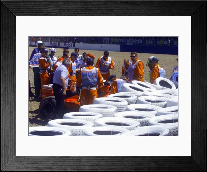 Framed Print : Stewards try to help Michael Schumacher out of his Ferrari after crashing into the wall Framed Print : Stewards try to help Michael Schumacher out of his Ferrari after crashing into the wall
