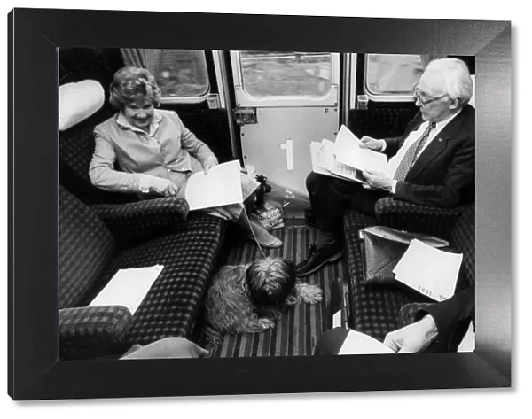 Michael Foot and wife Jill Craigie on train with their dog - May 1983